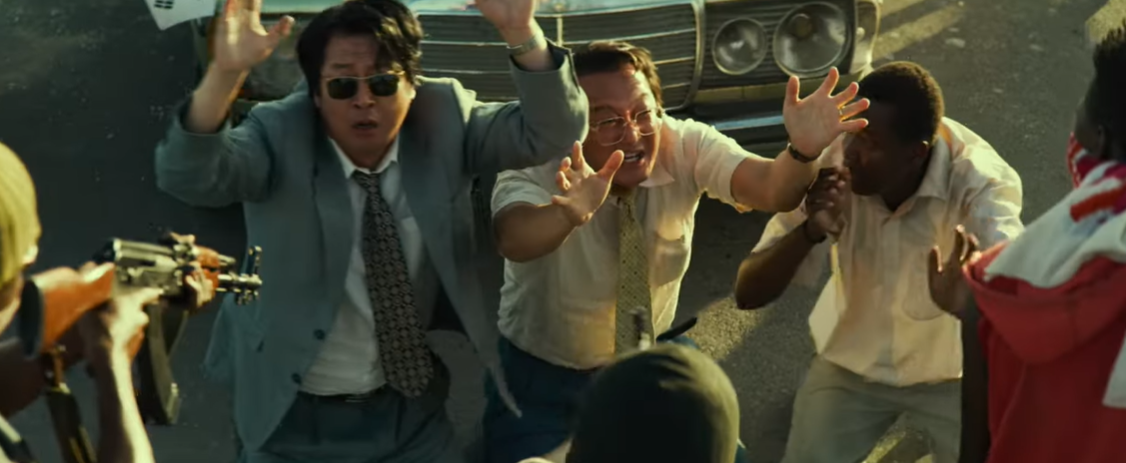 South and North Korean diplomats caught in a life-or-death standoff in the 2021 film "Escape from Mogadishu" | Source: YouTube/wellgousa